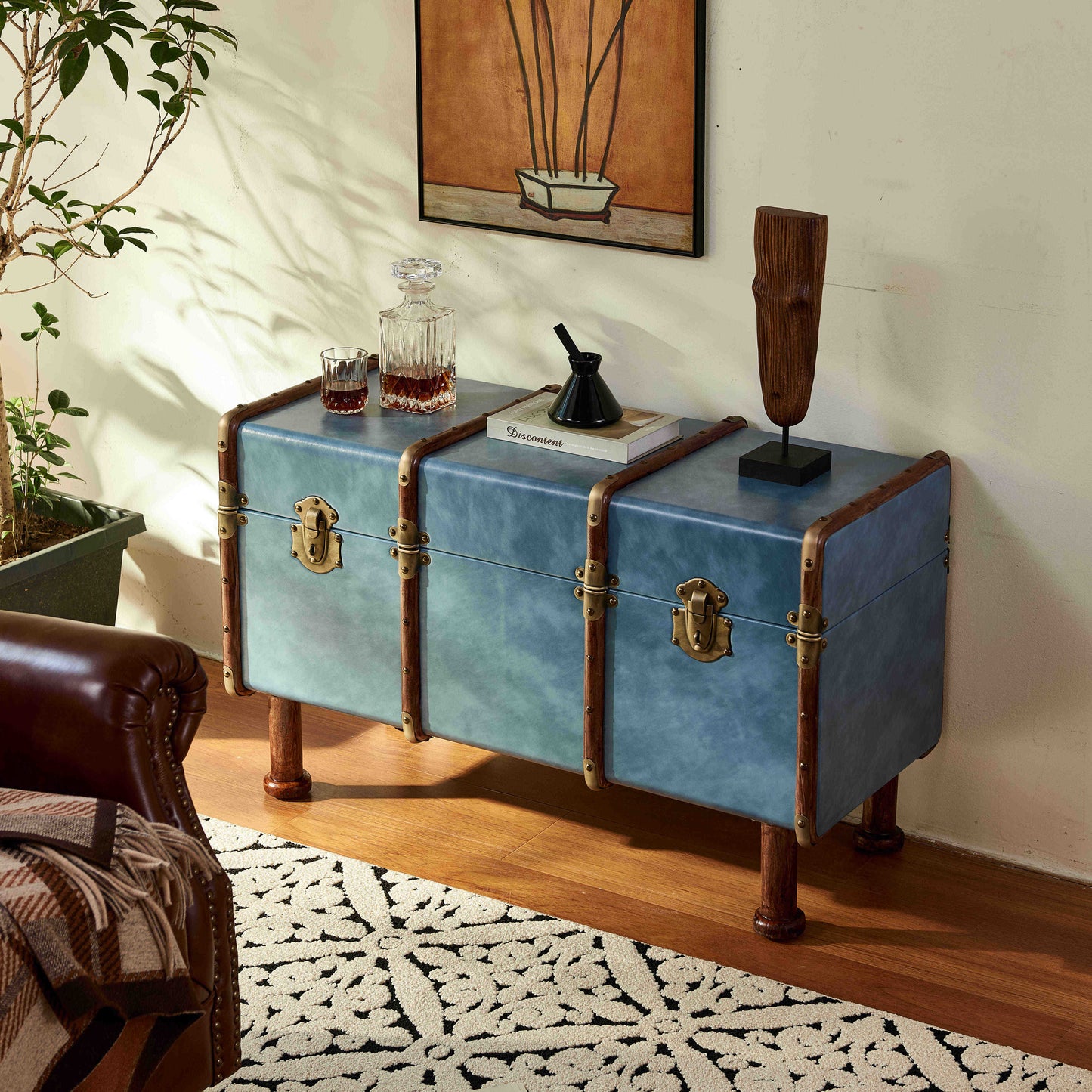 Vintage French Steamer Trunk Console Table – Distressed Blue Leather & Brass Hardware Storage Trunk on Wooden Legs, Classic Travel-Inspired Furniture
