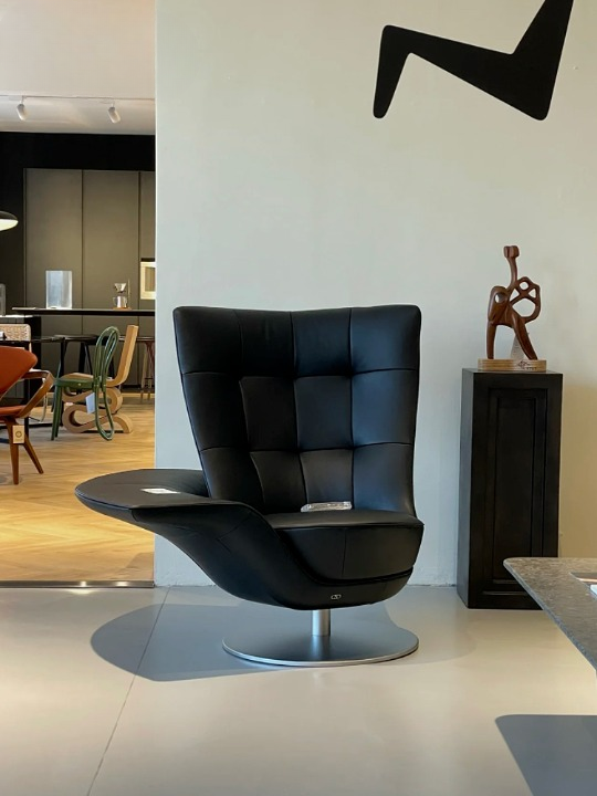 Black Swivel Lounge Chair with Tufted PU Leather Upholstery