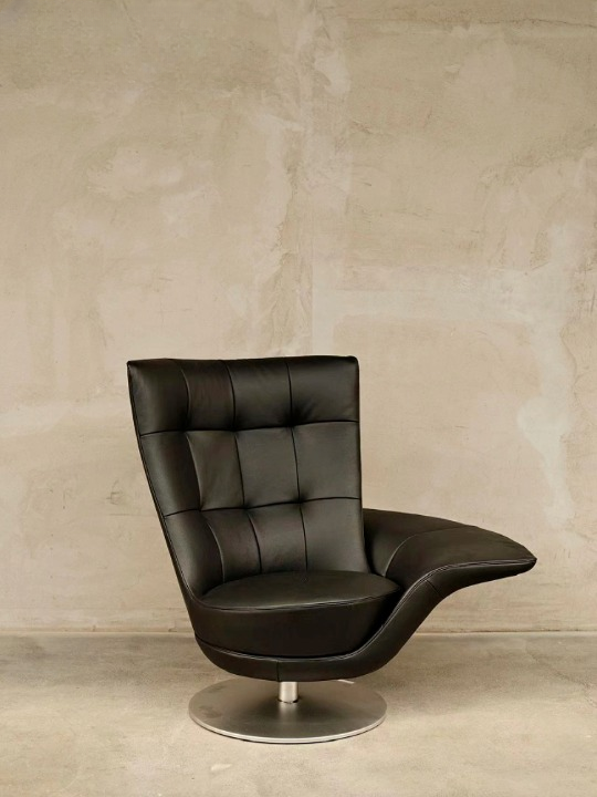 Black Swivel Lounge Chair with Tufted PU Leather Upholstery