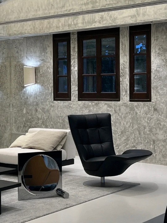 Black Swivel Lounge Chair with Tufted PU Leather Upholstery