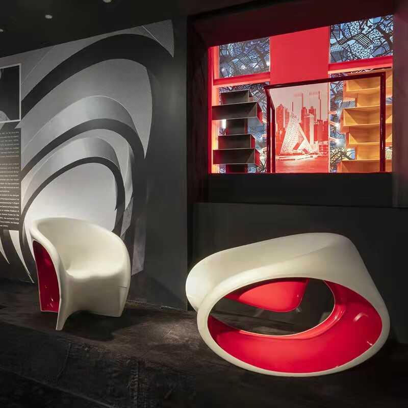 Creative Fiberglass Hollow-Out Lounge Chair, Modern Orange Sculptural Rocking Accent for Villa, Reception, or Sales Office